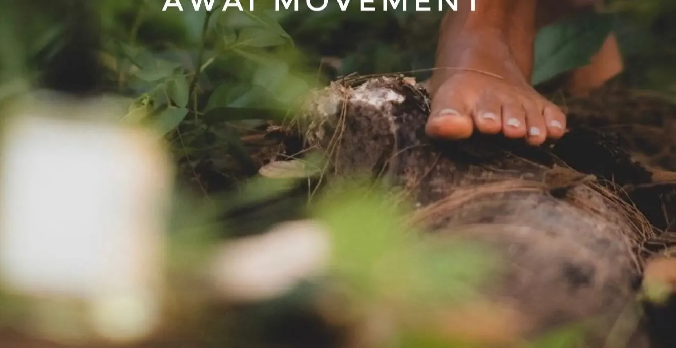 Bare feet on earth and greenery